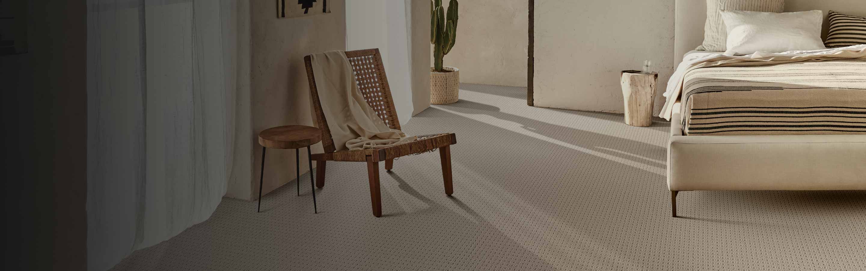 Beige carpet in a southwest style bedroom