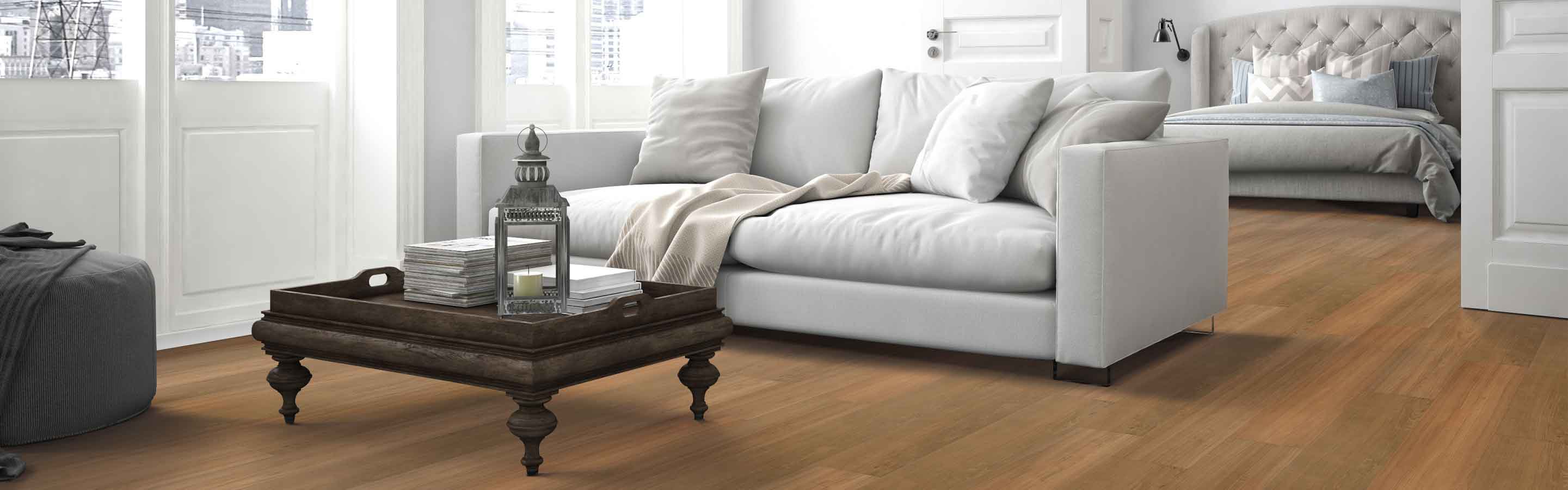 honey hued wood look vinyl in all white contemporary living room with double doors to master bedroom